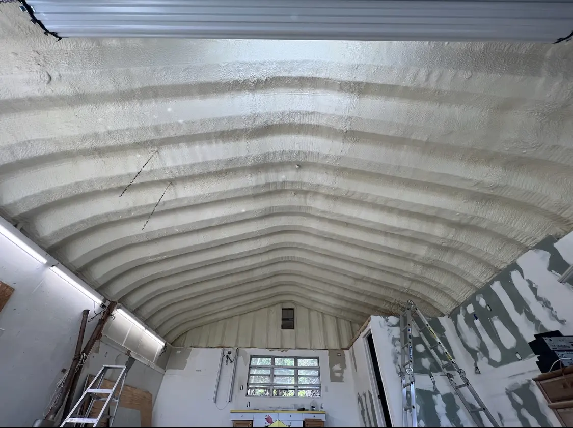 Spray polyurethane foam applied to the underside of a metal roof deck in Silverthorne
